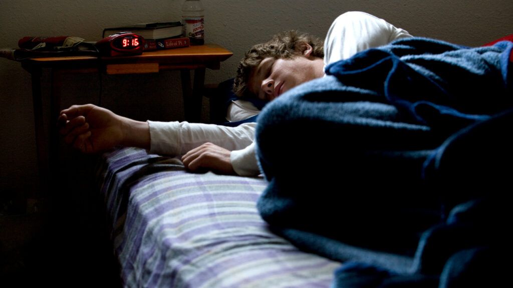 Man asleep in bed